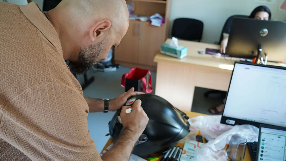 Close-up of signatures on the helmet