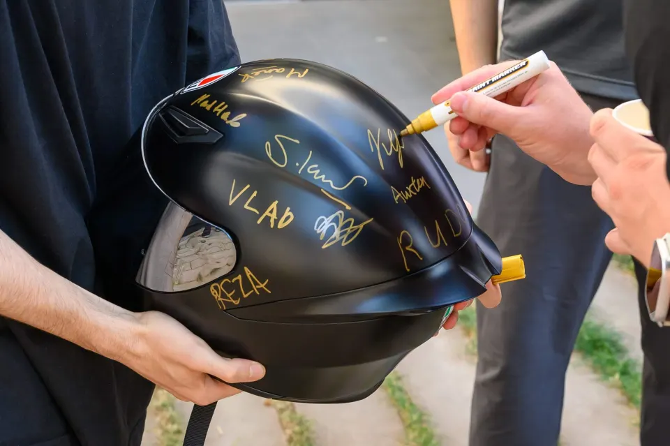 A speaker signing the helmet
